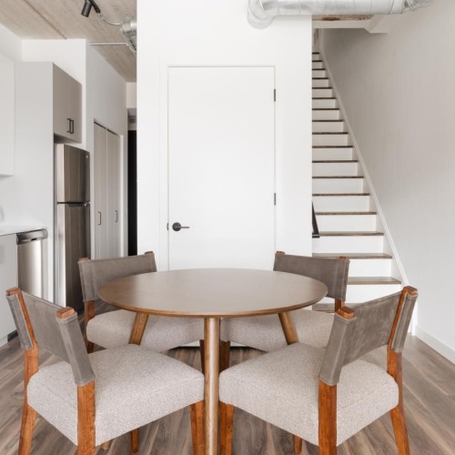 a kitchen with a table and chairs