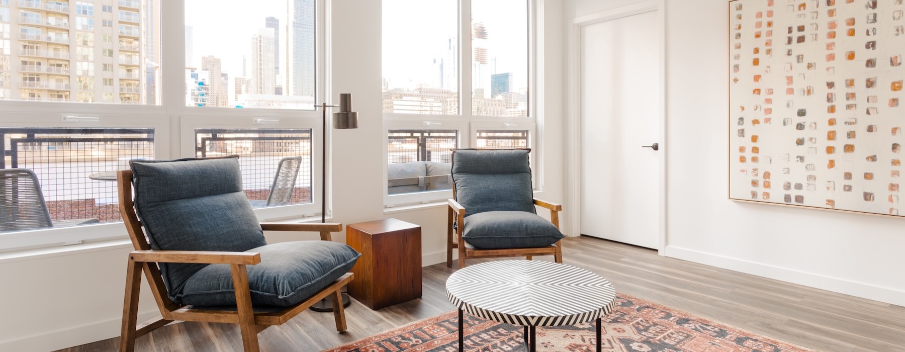 a living room with chairs and a coffee table