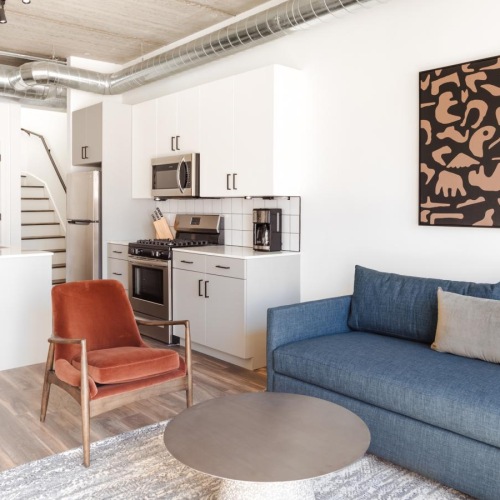 a living room with a couch and a table