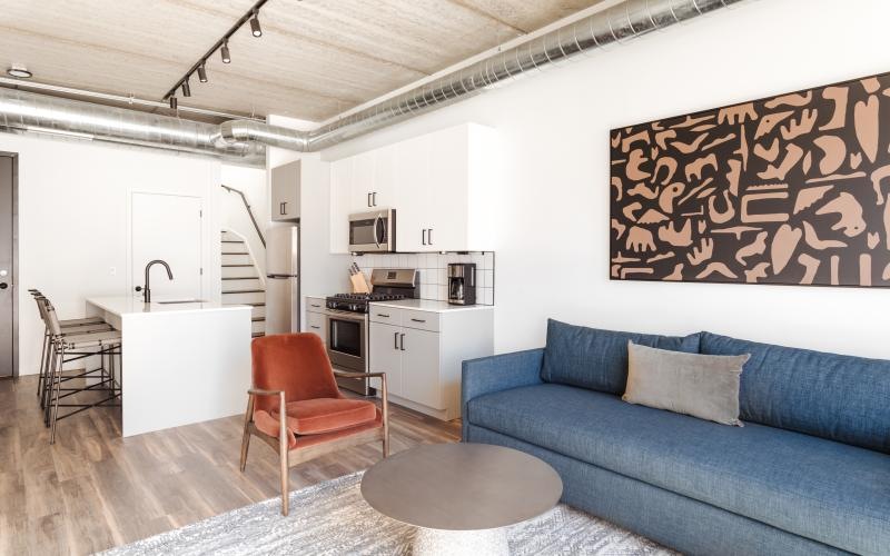 a living room with a couch and a table