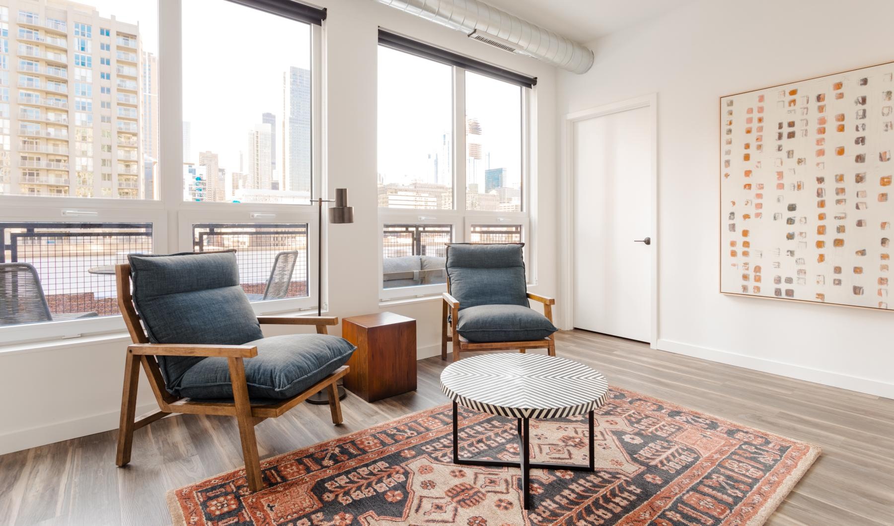 a living room with chairs and a coffee table